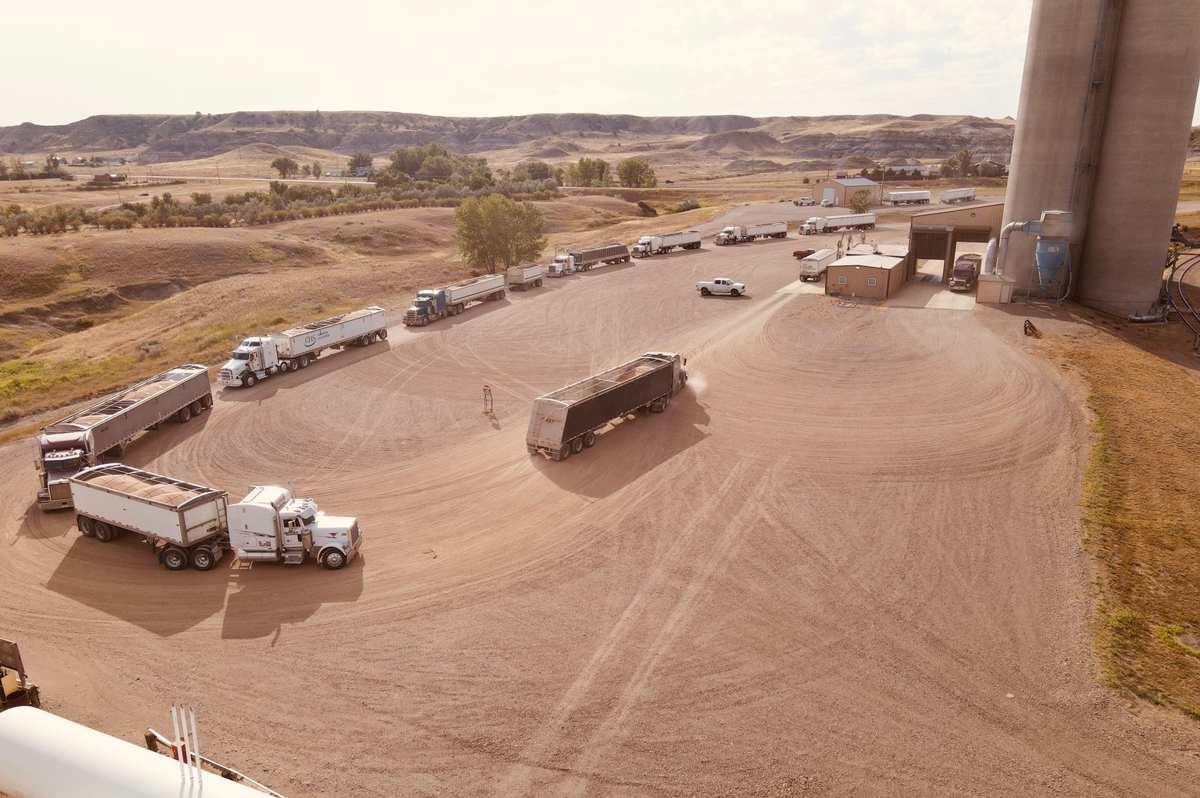 Trucks pulling up to a grain shuttle
